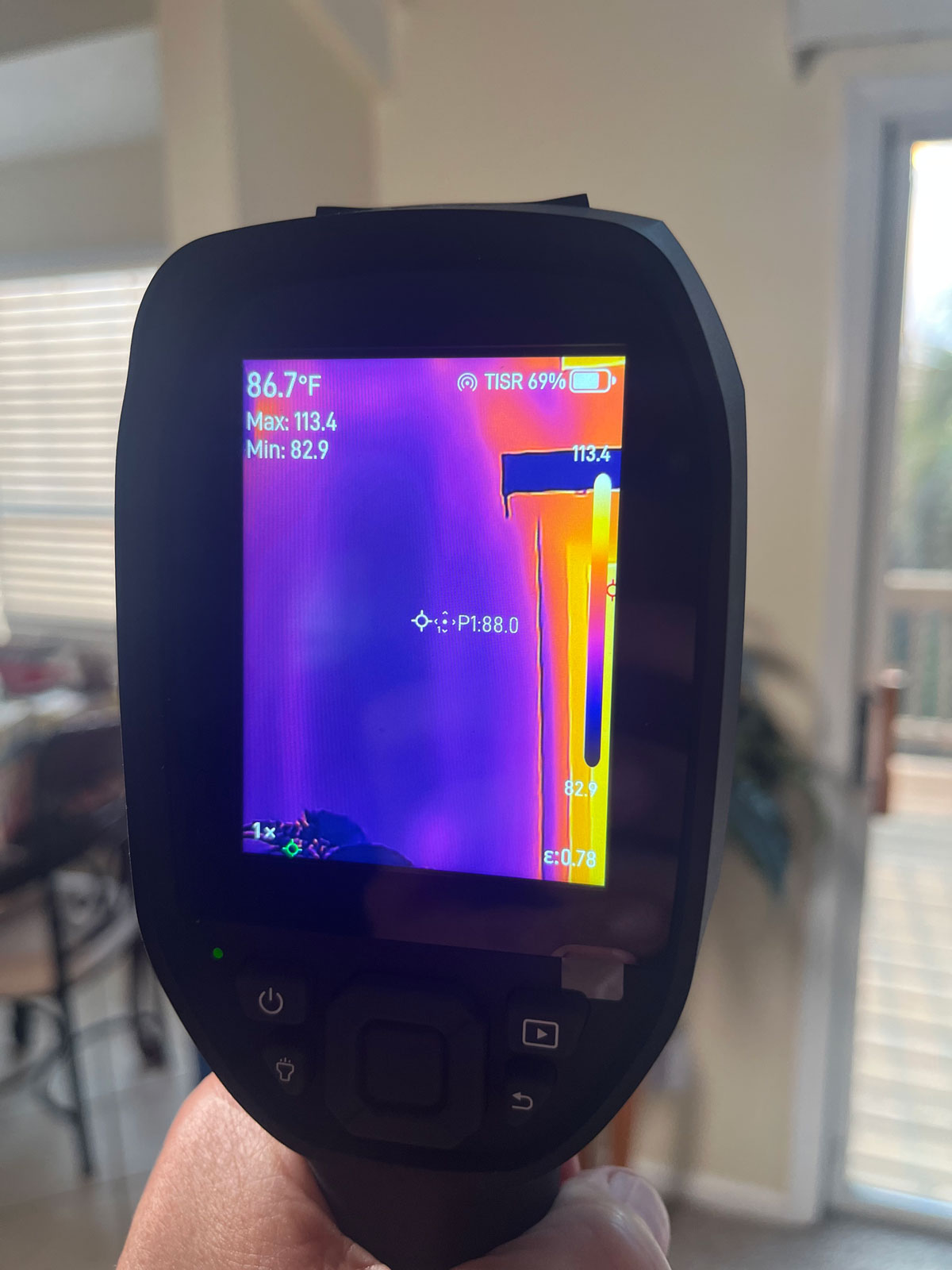 Thermal imaging revealing hidden moisture behind an interior wall